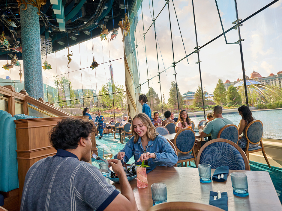 Guests dining inside Atlantic in Celestial Park at Epic Universe