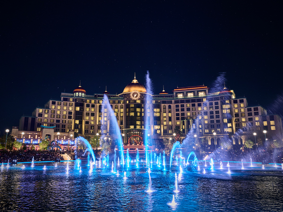 Helios Grand Hotel at night in Celestial Park at Epic Universe