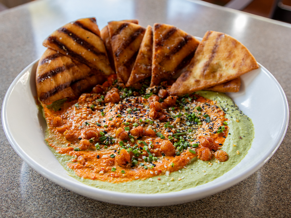 Plate of the new Summer Avocado Hummus at Confisco Grille in Universal Islands of Adventure.