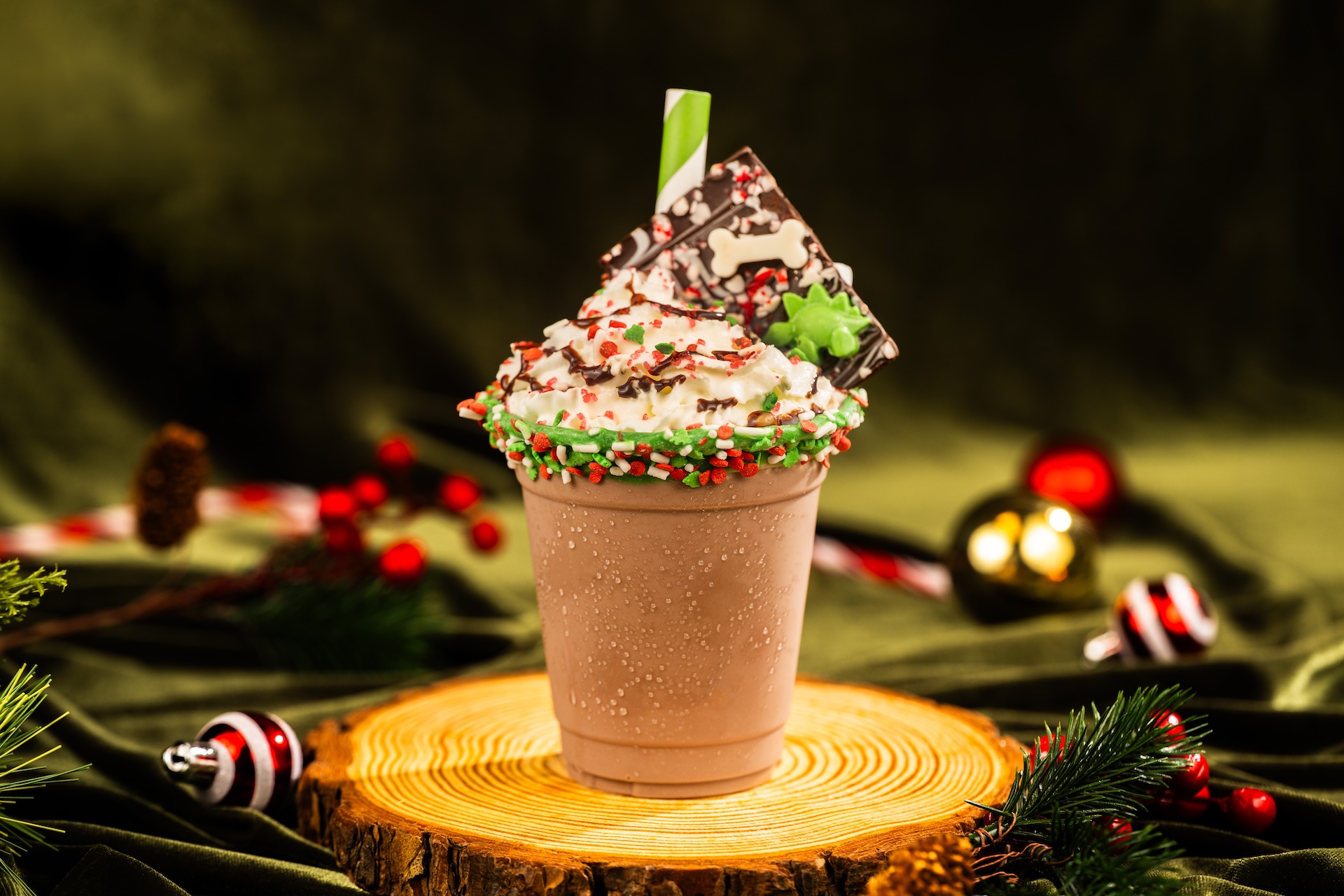 Frozen Hot Cocoa: Frozen Hot Cocoa by Joffrey's with toasted marshmallow, whipped cream, holiday sprinkles, chocolate dinosaur, and a chocolate rim (New) 
