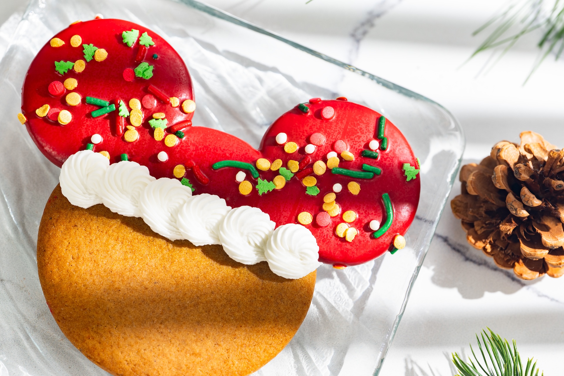 Santa Mickey Gingerbread Cookie: Gingerbread cookie dipped in white chocolate with royal icing and sprinkles (New) 