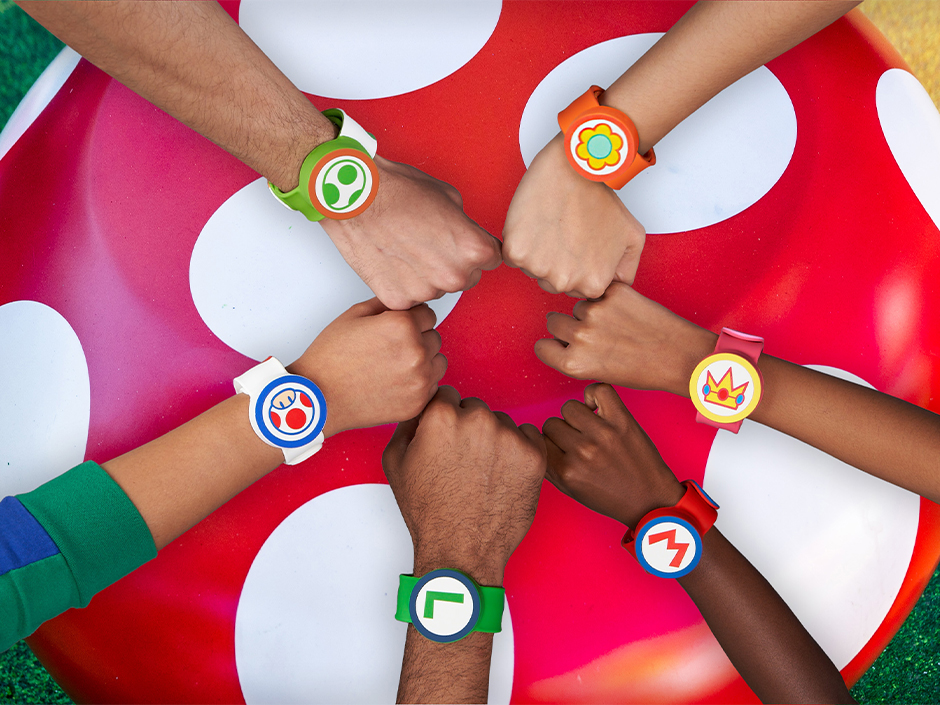 A group shot of several Power-Up Bands available at SUPER NINTENDO WORLD.