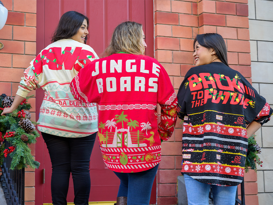 Three guests in holiday-themed spirit jerseys.